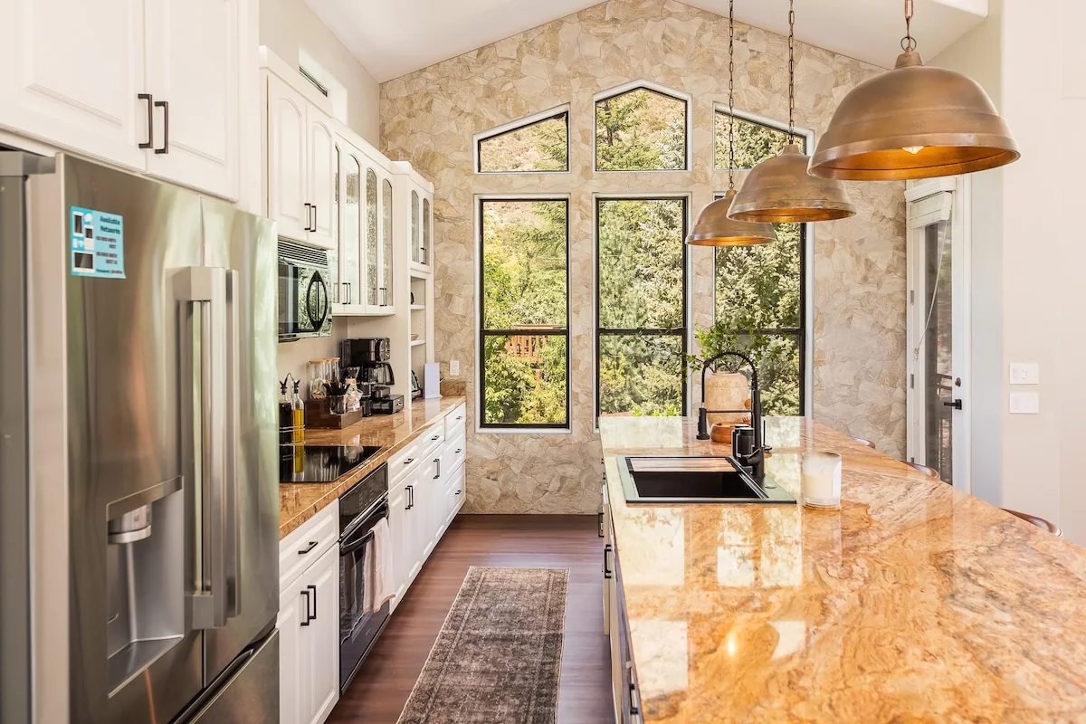 Bright kitchen with a large island and canyon views